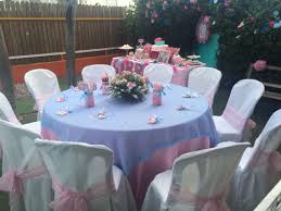 Pink, purple, peach, and teal balloon garland adorned with pink and white roses and greenery, which cascaded down the table. Pink And Blue Baby Shower Table Decorations Cheap Online Shopping
