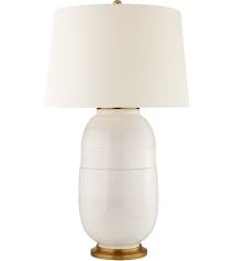 The resin table lamp features a hammered base design with a champagne silver finish and linen hardback cylindrical shade. Christopher Spitzmiller Newcomb 37 Inch 100 Watt Ivory Table Lamp Portable Light Portable Light Visual Comfort Table Lamp