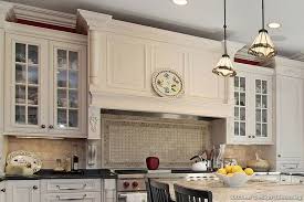 Modern kitchen with dark stain shaker cabinets. A Traditional White Kitchen With A Dark Cherry Island Simple Kitchen Design Kitchen Range Hood Kitchen Design