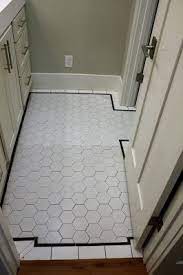 See more ideas about diy mirror, bathroom decor, bathroom makeover. Hall Bath Floor With Large White Hex Tile And Black Pencil Tile Border Tile Bathroom Black Floor Tiles Bathroom Flooring