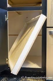 Start off by building your cabinet's base from four 2×4 boards then proceed to install dividers. How To Build Pull Out Shelves For A Blind Corner Cabinet Part 1