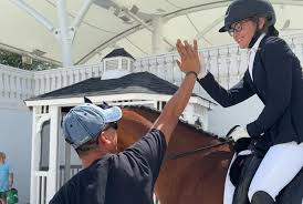 So proud of our student Miriam Bacon who did an amazing job riding her own  Drambuie in the FEI Children's Test during the CDI WEC Ocala show. She  showed great skill and