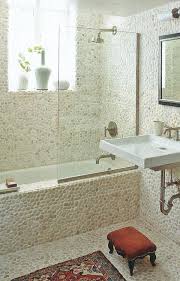 An aqua colored bathroom with lots of ledges along the walls and starfish and seashells plus gold touches. 20 Beach Bathroom Decor Ideas Beach Themed Bathroom Decorating