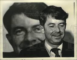 1977 Press Photo Senator Howard Nolan standing in front of photograph of  himself