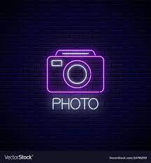 Neon Sign Of Photo Camera Symbol With Text On Dark Brick Wall Background Photography Camera Sign Photo Logo Neon Signs Neon Wallpaper Wallpaper Iphone Neon Flamingo neon flamingo lights flamingo logo neon aesthetic aesthetic rooms neon light signs neon signs neon rose mode rose. pinterest