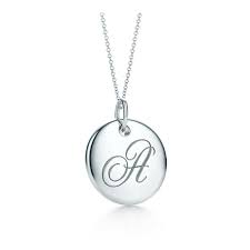Charm necklaces were the ultimate status symbols. Tiffany Notes Alphabet Disc Charm In Silver On A Chain Letters A Z Available Disc Charm Charm Pendant Pendant