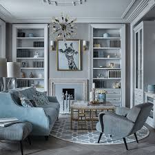 Light Grey Walls Wooden Flooring Blue Sofa With Printed Throw Pillows Large Bookshe Living Room Furniture Arrangement Perfect Living Room Living Room Stands