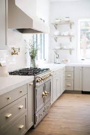 Gray Beige Kitchen Cabinets Open Shelving Gold Hardware Gold Cabinet Drawer Pulls Light Grey Kitchens Kitchen Design Light Grey Kitchen Cabinets