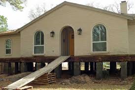 Land use zoning aims to locate common uses close together such as putting: Raising A House Above The Floodplain