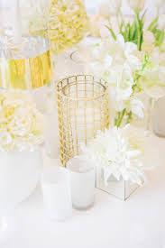An Assortment Of Gold White Glass Candles Vases Flowers Www Weddingconcepts Co Za Luxury Wedding Planner Floral Wedding Wedding Planner