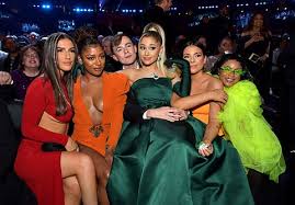 Ariana grande arrived on the red carpet wearing a tulle grey giambattista valli ballgown, matching gloves, and her signature high ponytail. Ariana Grande Wears Third Dress During Grammys 2020 Broadcast