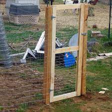 Hammer poultry staples into the top, center and bottom of the fence. How To Put Up A Fence And Build A Gate Building A Gate Chicken Wire Fence Diy Garden Fence
