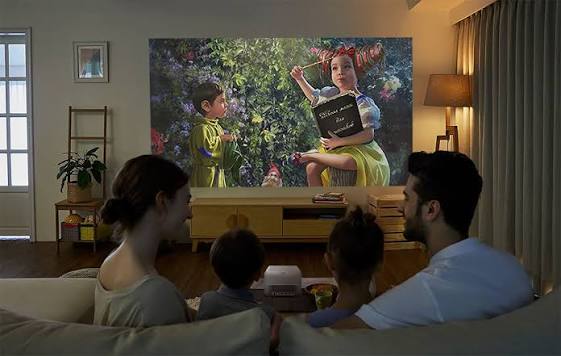 Family relaxing watching movies on couch
