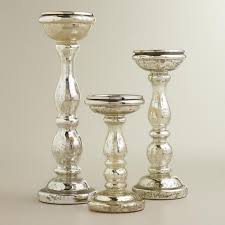 We have stately gold candlesticks for old world elegance, rustic cylinder vases, and mirrored candle holders for futuristic style. Amalie Silver Mercury Glass Pillar Candle Holders Mercury Glass Pillar Candle Holders Glass Pillar Candle Tall Glass Pillar Candle Holders