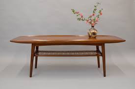 The tabletop shows a richly warm grain pattern classic of midcentury design. Danish Teak Cane Surfboard Coffee Table Randlev Mobelfabrik Sold Vintage Modern Maine
