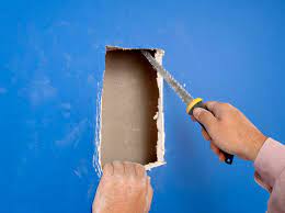 Sand your patch area smooth. How To Fix Large Holes In Drywall With A Patch Dummies