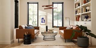 The range of harmonious tonal blues on the walls, curtains, and couch are refreshing and relaxing. Living Room Inspiration West Elm