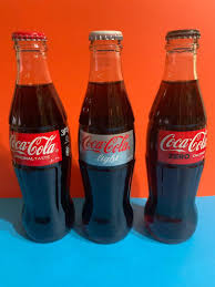 He launched a national contest for a new bottle design that would signal to consumers that coke was a premium product that couldn't be confused with some other brown cola in the root glass company in terre haute, indiana, decided to enter the contest and base its design off the product's name. Set Of 3 Coca Cola Glass Bottle From Dubai Uae Hobbies Toys Memorabilia Collectibles Vintage Collectibles On Carousell