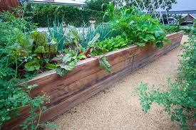 One of the main advantages of a raised bed is that the soil doesn't get compacted the way it might in a conventional bed because they are planned for accessibility. Diy How To Create A Raised Garden Bed Gnh Lumber Co