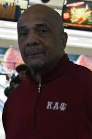 Vice Polemarch Evergreen Park Alumni Brother Gerald Jones fellowships with  Kappa Leaguers and his son at a bowling event