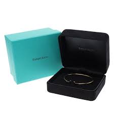 Discover creations of timeless beauty and superlative craftsmanship that will be treasured always. Tiffany Co T Yellow Gold Narrow Wire Bracelet Tiffany Co Tlc