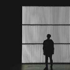 Quarterback american football player man standing silhouette. Hd Wallpaper Silhouette Photo Of A Person Standing Near Wall In Dark Room Silhouette Man In Jacket Standing In Front Of Light Wallpaper Flare