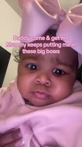 Dad Makes Fun of Baby with Big Bow