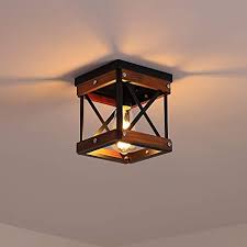 Our collection of flush mount lighting hangs a warehouse shade as tightly to the ceiling as possible, greatly reducing the amount of space it occupies. Amazon Com Fivess Lighting Rustic Farmhouse Flush Mount Ceiling Light 1 Light Metal And Wood Cage Mini Semi Flush Mount Light Fixture For Hallway Kitchen Entryway Black Kitchen Dining