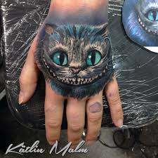 Tattoos im gesicht und auf dem kopf. Cheshire Cat Hand Tattoo Grinsekatze Tattoo Tatowierungen Disney Tattoo Ideen