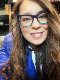 Danielle Crull is wearing a beautiful colourful frame by Menizzi Eyewear
