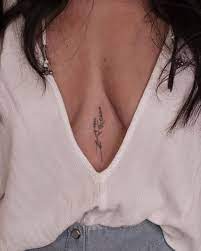 Small Tattoos On Instagram Sternum Lavender Piece By Firstjing Los Angeles New York City Lavender Tattoo Feminist Tattoo Chest Tattoos For Women