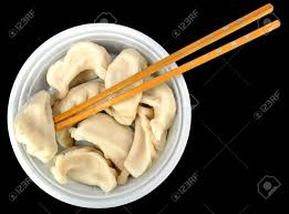 In the united states, the term dim sum has generalized to also refer to a style of eating or restaurant experience in which small plates of chinese cuisine are presented on mobile carts to seated patrons. Steamed Vegetable Dumplings With Chop Sticks On A Black Background Stock Photo Picture And Royalty Free Image Image 33490262