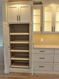 There are 2 shelves on top and bottom to store a variety of items. Tall Pantry Cabinet With Slideout Shelves In A Remodeled Bettendorf Iowa Home Villagehome Tall Kitchen Storage Tall Kitchen Cabinets Kitchen Cabinet Storage
