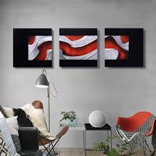 The designer chose a black headboard and bed frame, black vertical wall stripes and hints of black in the bedding to tame the red. China Black Red Silver 3d Metal Wall Sculpture Arts Modern Interior Crafts Decor Wholesale From China Factory Manufacture And Factory Handsome Home Decor