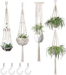 This set of two decorative hangers feature a scroll design and a solid steel construction that is powder coated for a finish that will stand up to the outdoor elements for years to come. Amazon Com Mkono Macrame Plant Hangers Set Of 4 Indoor Hanging Planter Basket Wall Decorative Flower Pot Holder With 4 Hooks For Indoor Outdoor Home Decor Gift Box Ivory Kitchen Dining