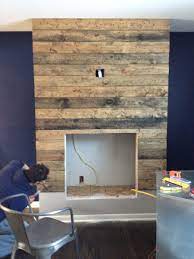 How To Create A Diy Reclaimed Wood Fireplace Surround For Less Than 100 Wood Fireplace Surrounds Reclaimed Wood Fireplace Fireplace Surrounds