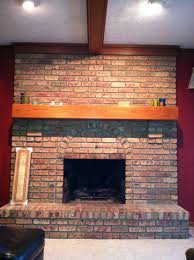Red brick surrounds a tall fireplace, reaching more than halfway up the wall. 1980s Large Red Brick Fireplace Ideas To Update