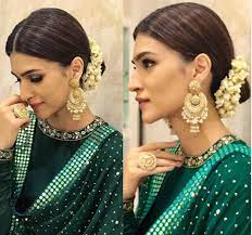 Gajra hairstyle as traditional bun: 10 Gajra Hairstyle Inspirations From Our Favorite Bollywood Celebs The Wedding Brigade Blog