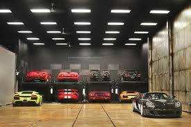 love the garage but would totally switch out all those garish cars for classics 70s era datsuns nissans and bi dream garage garage design dream car garage