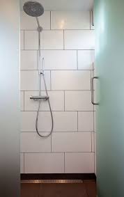 Danish Home Black And White Contrast With Touches Of Yellow Nordicdesign White Bathroom Tiles White Tile Shower Retro Bathrooms
