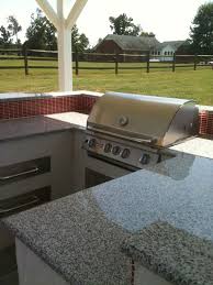 Covered Outdoor Kitchen Black White Granite Counter Red Glass Tile Backsplash Barstoo Covered Outdoor Kitchens Outdoor Kitchen Countertops Outdoor Kitchen