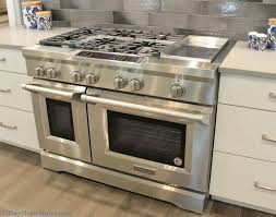 Painted White Cabinetry And Kitchenaid Appliances Including 48 Wide Gas Range With Griddle Villagehomestores Com Kitchen Aid Appliances Kitchen Kitchen Aid