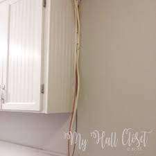 Hide your cords inside a cute wicker basket and place it under a desk or tv stand: How To Hide Ugly Wires In Plain Sight Cord Hider Sleeves My Hall Closet