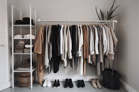 Clothes rack with neutral-toned sustainable outfits