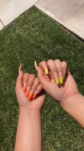 «✨ neon yellow, ombre and encapsulated glitter hearts on coffin nails 👌 • 💅 nail artist: Orange And Yellow Ombre Nails With Images Ombre Acrylic Nails Orange Acrylic Nails Faded Nails