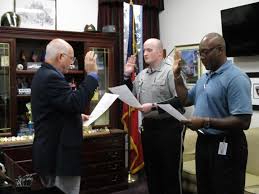 Sheriff David Davis Swears In Returning Deputy Wesley Hillard And Deputy Christopher Burtrum During A Special Ceremo Bibb County Return To Work Sheriff Office