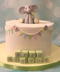 Little Elephant Baby Shower Cake With Name Blocks And Bunting Elephant Baby Shower Cake Baby Shower Cakes Neutral Baby Blocks Cake