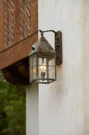 Tudor Style Wall Lantern Hangs From The Side Of The House Exterior Wall Light Porch Lighting Exterior Lighting