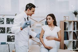 Some free services we offer: Doctor Is Showing The Pregnancy Test To Woman Girl Is Sitting Stock Photo Picture And Royalty Free Image Image 115744632