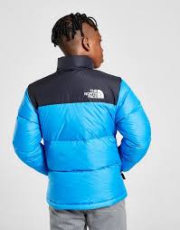 The shiny exterior has large baffles, which bring to mind the streetwear puffies of the. Blue The North Face Nuptse Jacket Junior Jd Sports